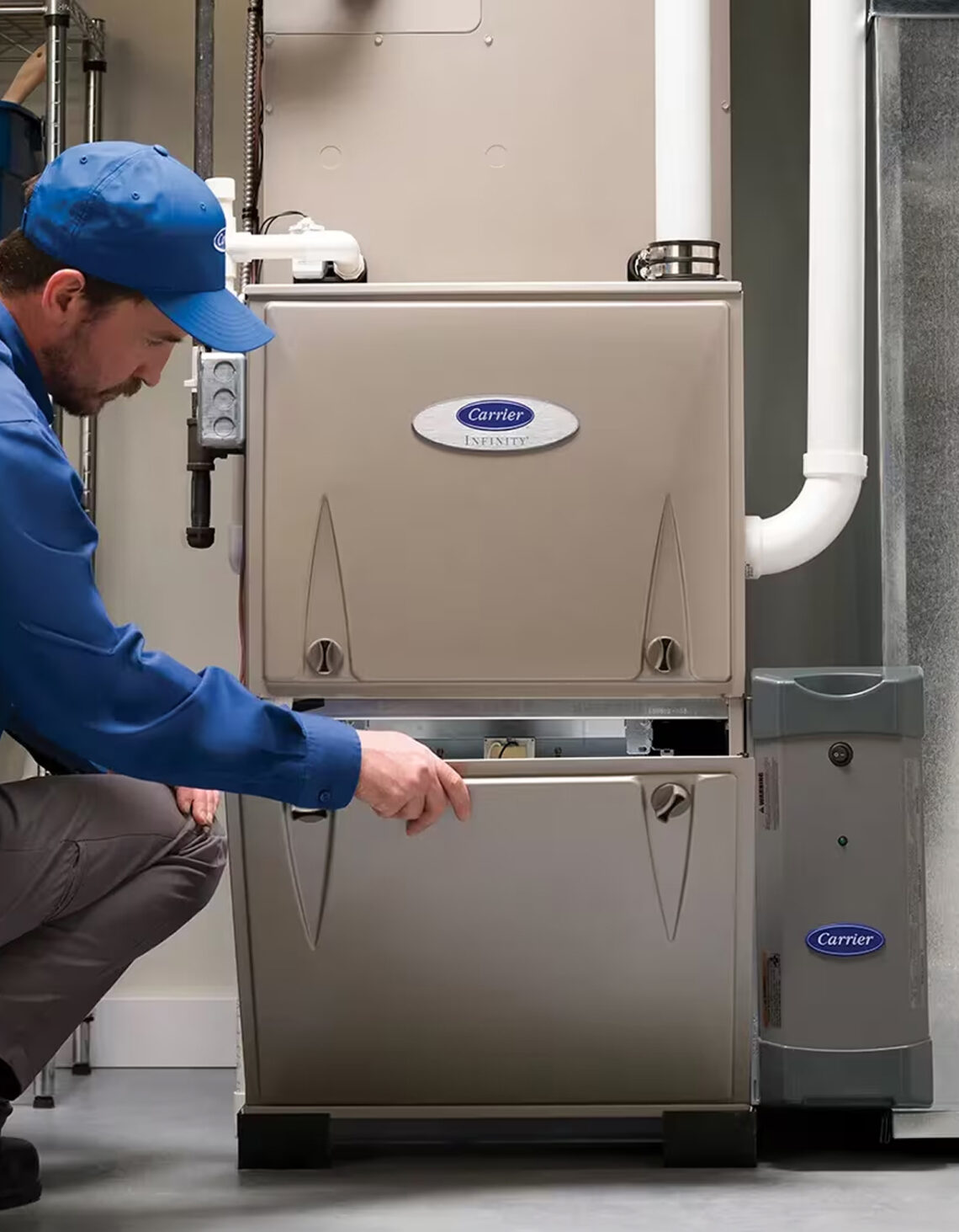 HVAC technician working on an indoor gas furnace.
